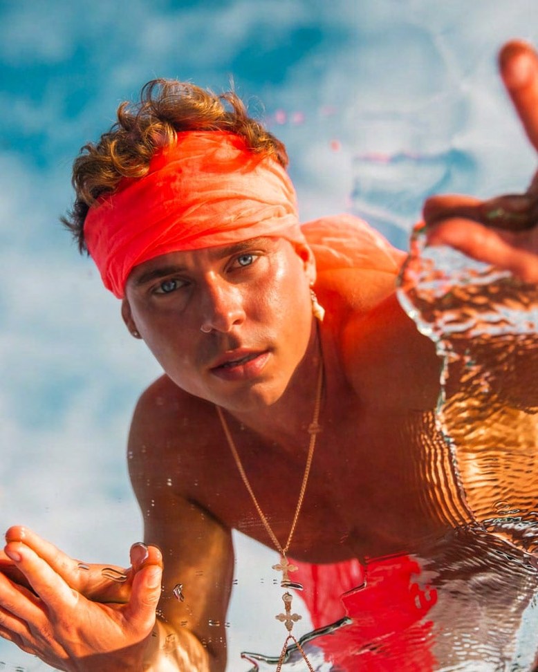Toni in a red headband outdoors