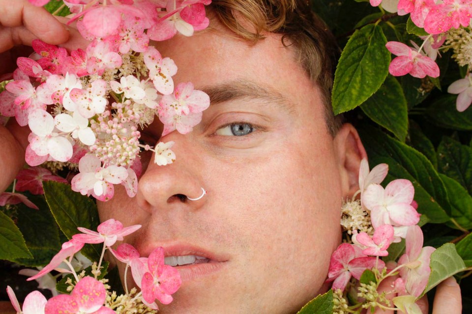 Portrait surrounded by pink flowers